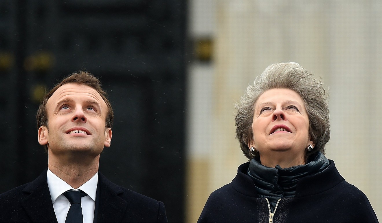 French President Emmanuel Macron and British Prime Minister Theresa May will not attend the annual economic forum. Photo: EPA-EFE
