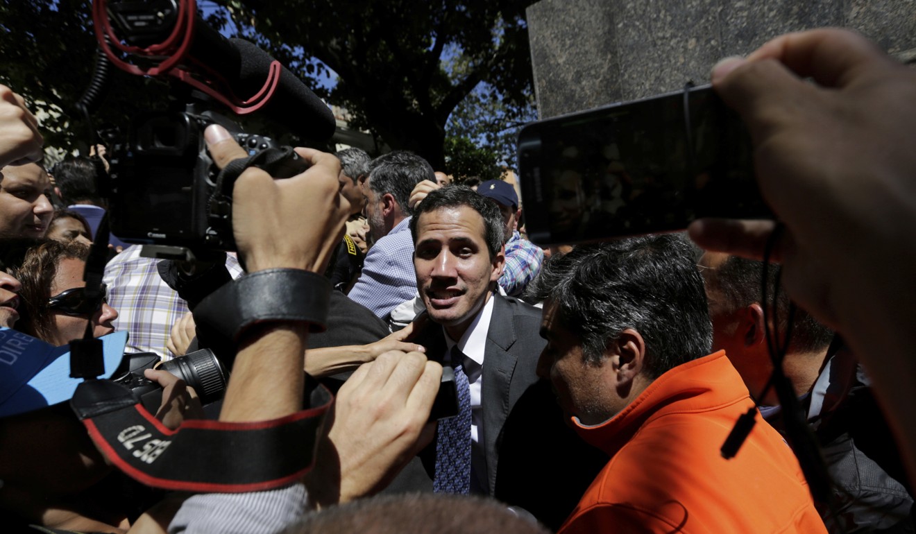 Guaido leaving the rally in Caracas. Photo: AP