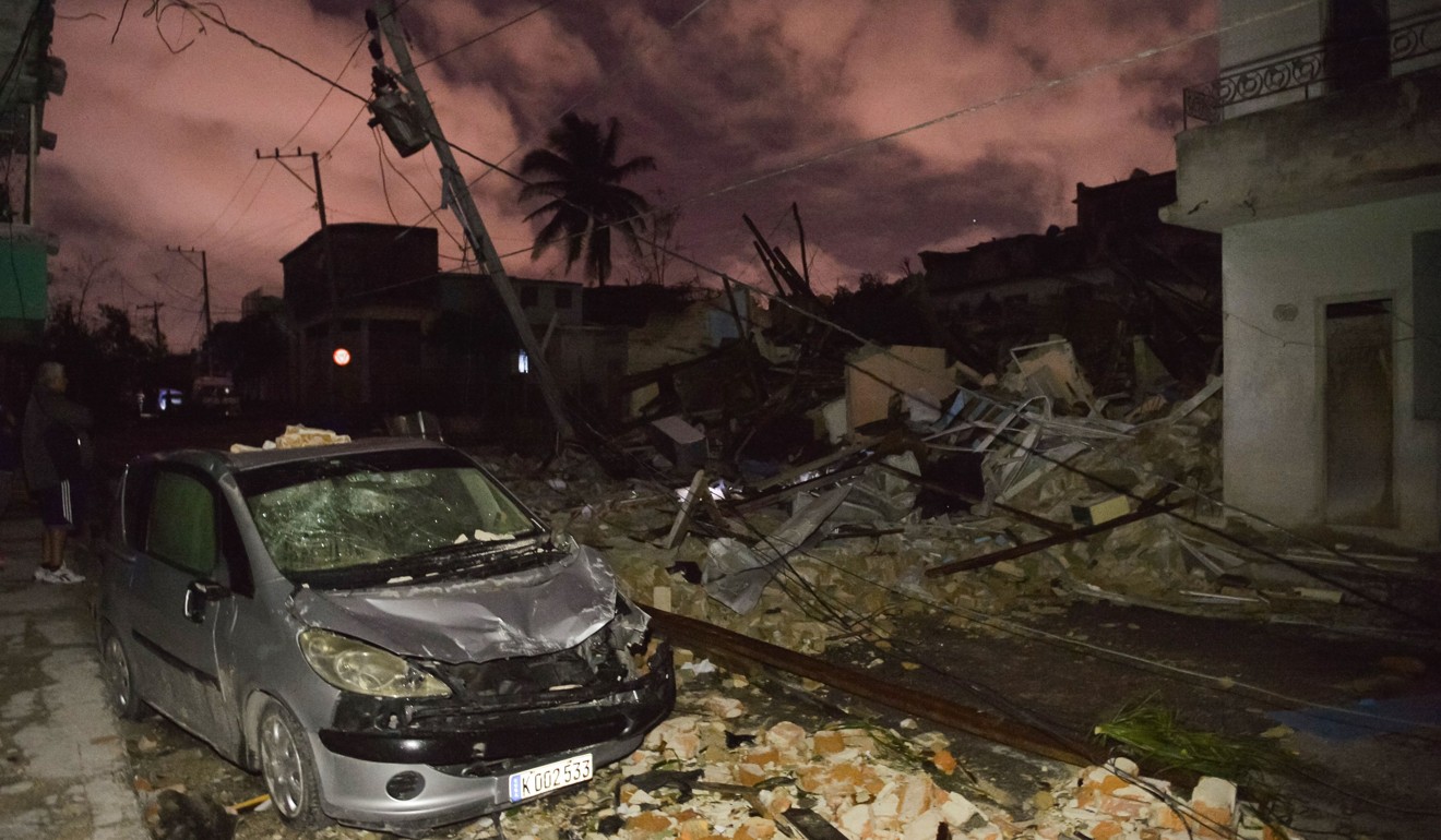 A damaged car in the tornado-hit Luyano neighbourhood in Havana early on Monday. Photo: AFP