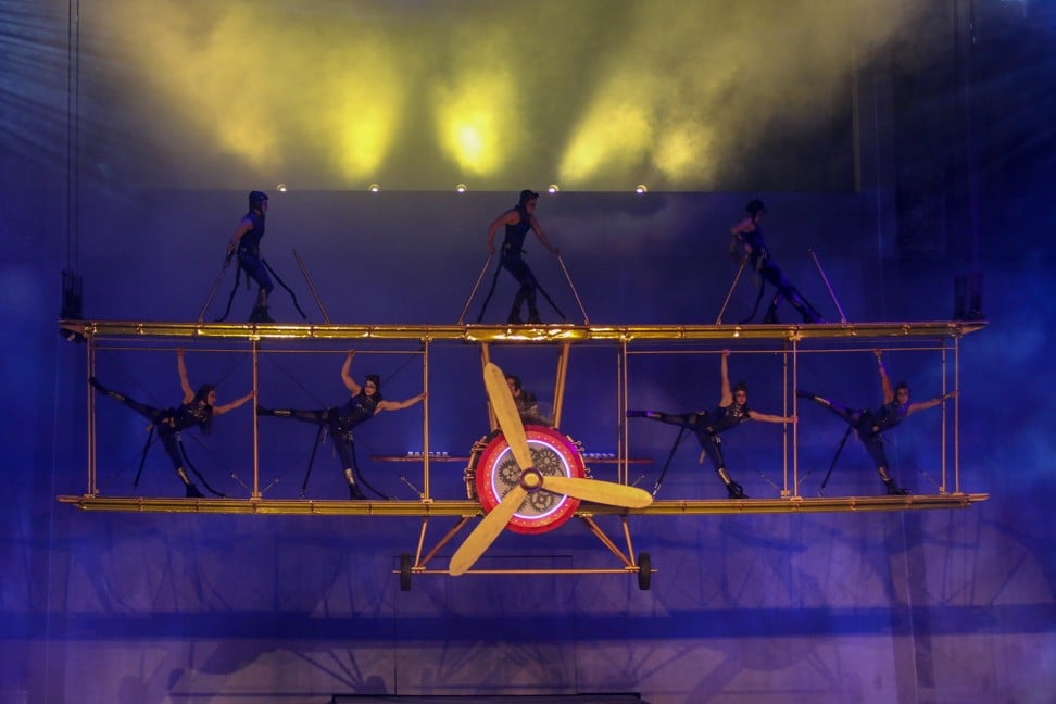 Aerialists perform on top of a biplane in Studio City’s new stunt show ‘Elekron’.