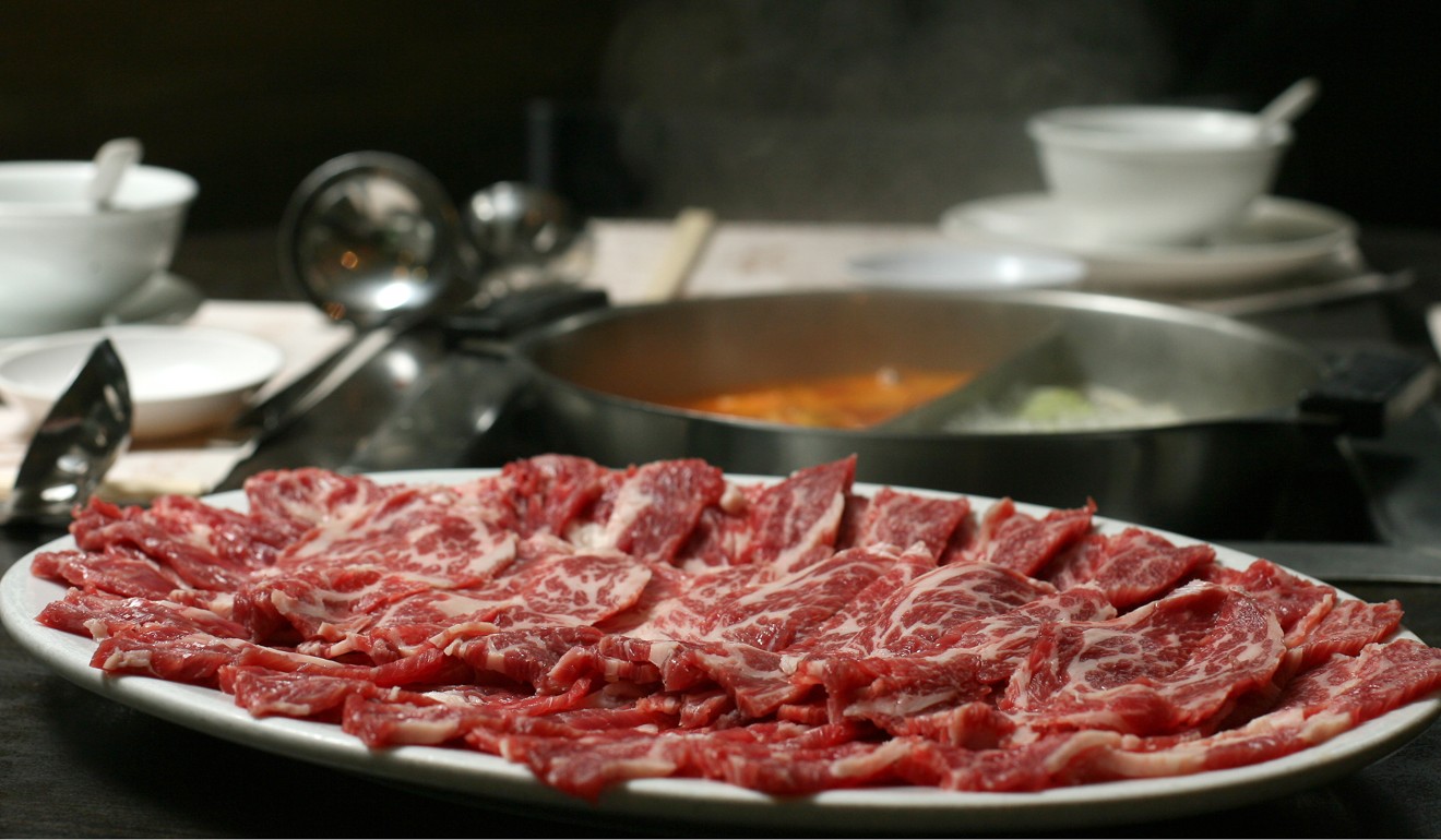 Sliced beef is prepared for a hotpot at Hot In A Pot restaurant. Photo: Ricky Chung