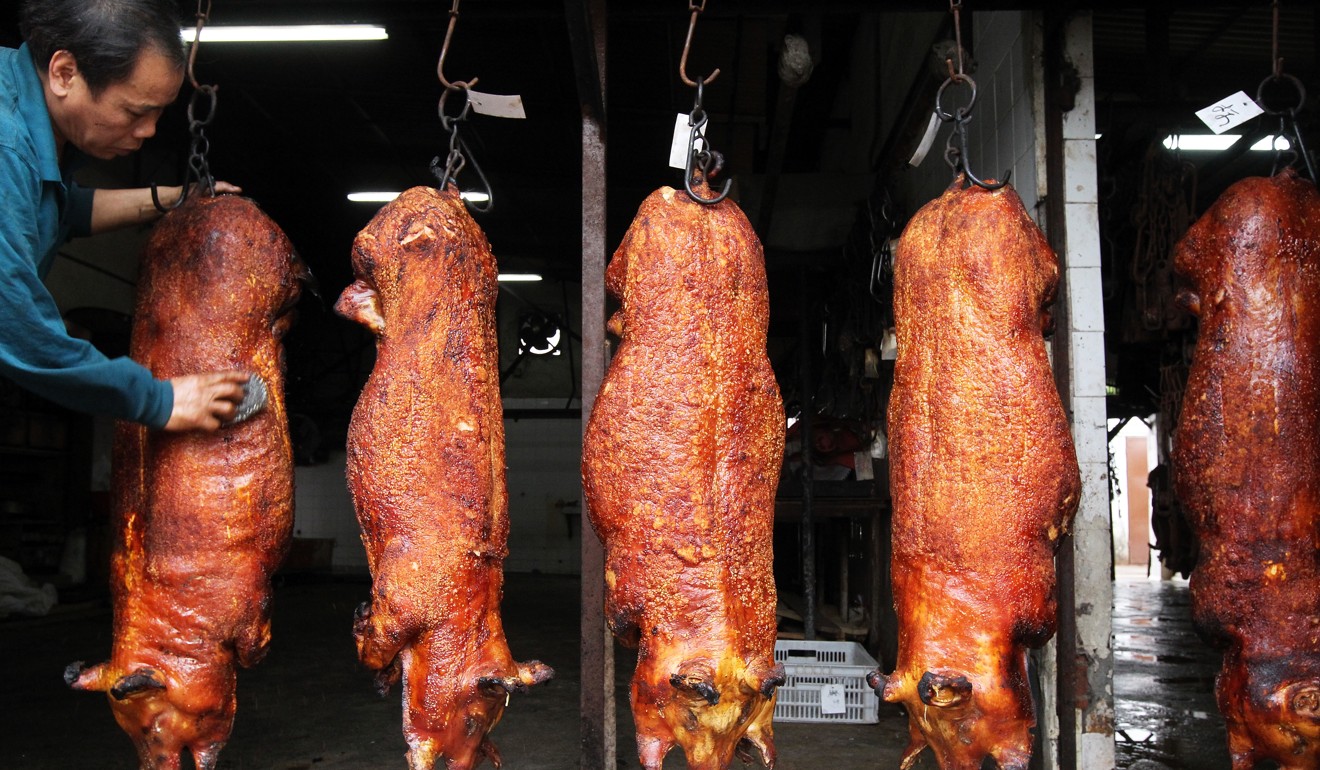 Pigs being roasted at Wing Kee Roast Pork in Lam Tei, Tuen Mun. Photo: K.Y. Cheng