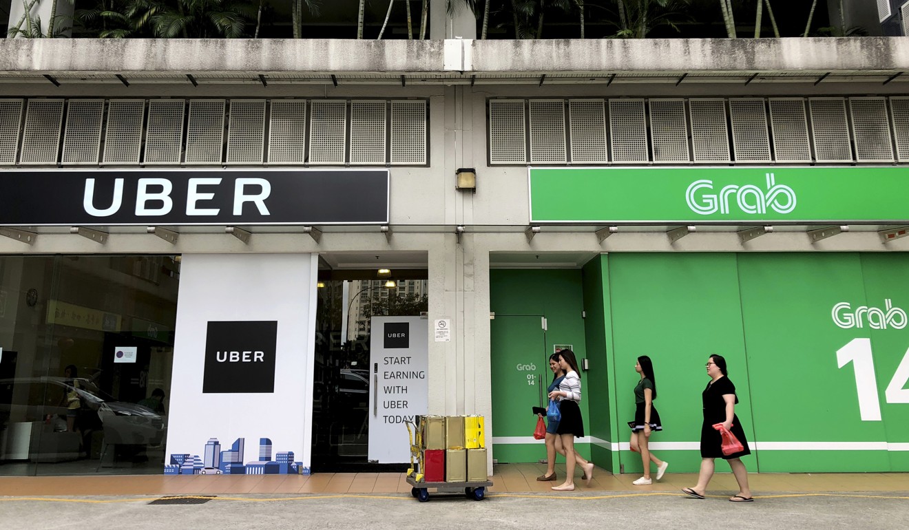 The Uber and Grab offices in Singapore. Singapore’s competition watchdog ride-hailing giant Uber and its regional rival Grab for their merger in Southeast Asia. Photo: AP