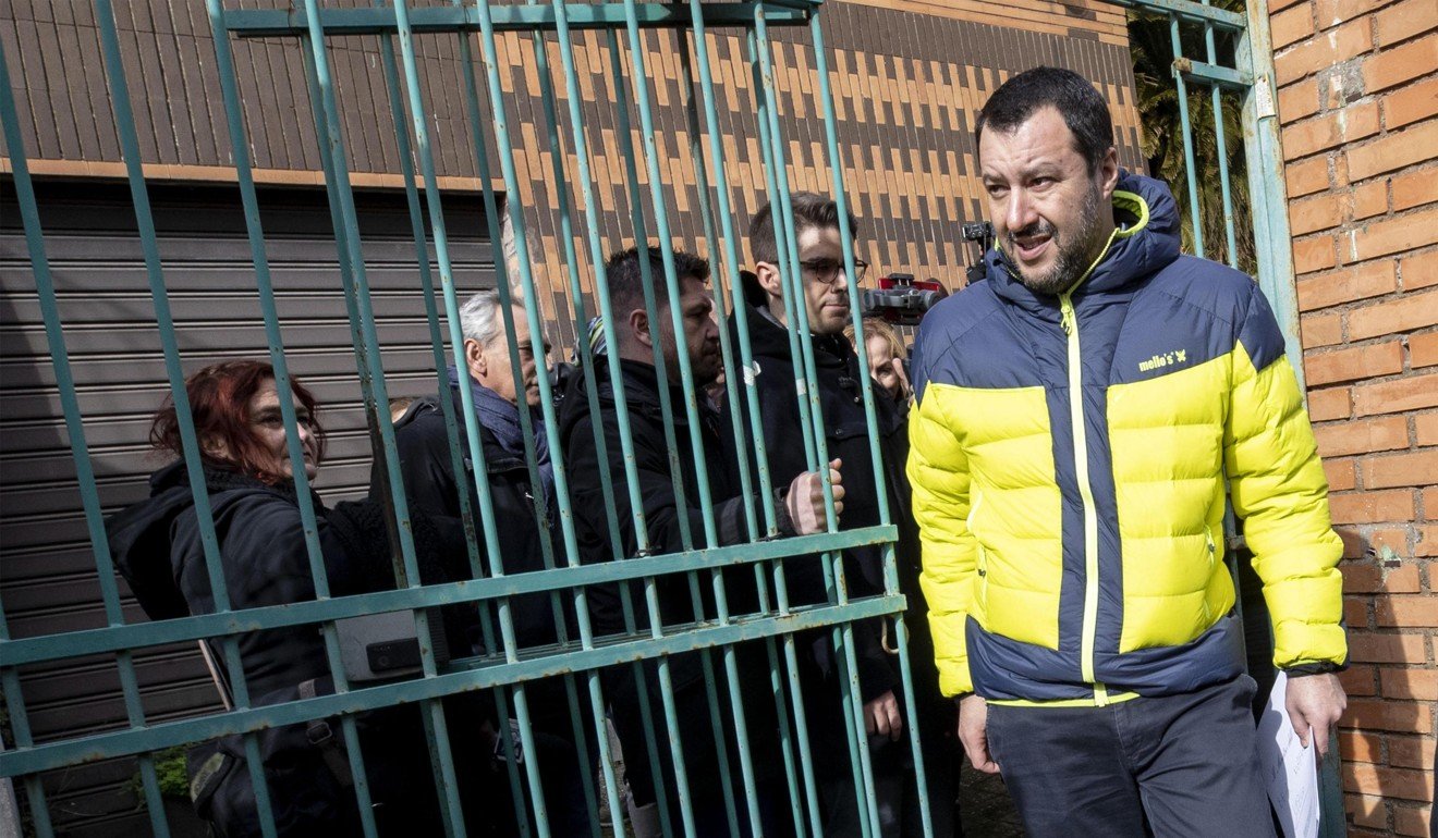 Italian Interior Minister Matteo Salvini leaves a house that was confiscated from the Italian mafia and returned to the Municipality in Rome. Photo: EPA