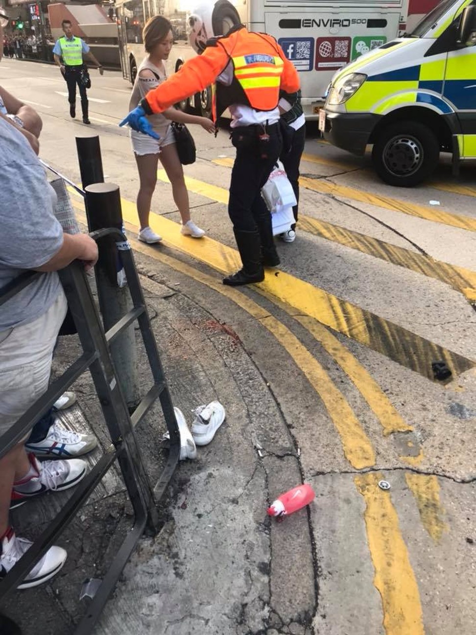 Police helping an injured pedestrian after the accident in Mong Kok in November 2017. Photo: Handout