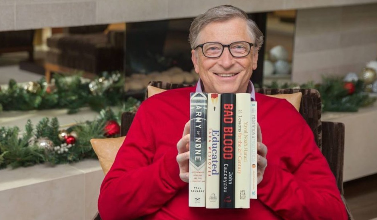 Bill Gates pictured at Christmas with a selection of new books. Photo: Bill Gates/Facebook