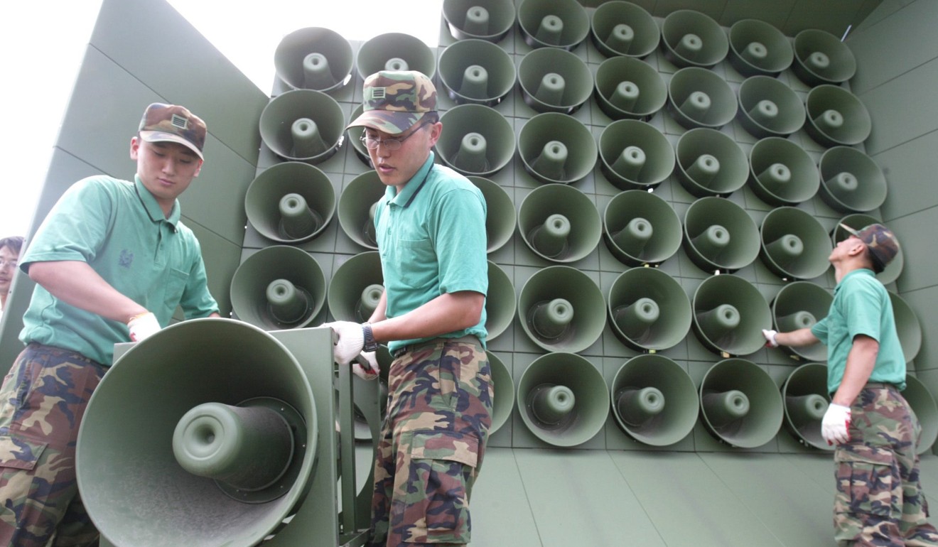 South Korean soldiers installing loudspeakers near the DMZ. Photo: EPA