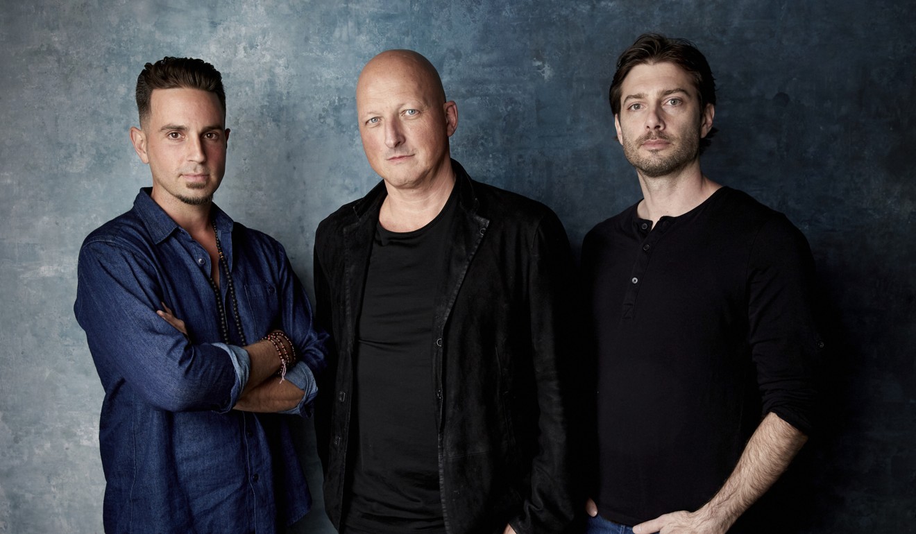 From left, Wade Robson, director Dan Reed and James Safechuck pose for a portrait to promote the film “Leaving Neverland”. Photo: AP