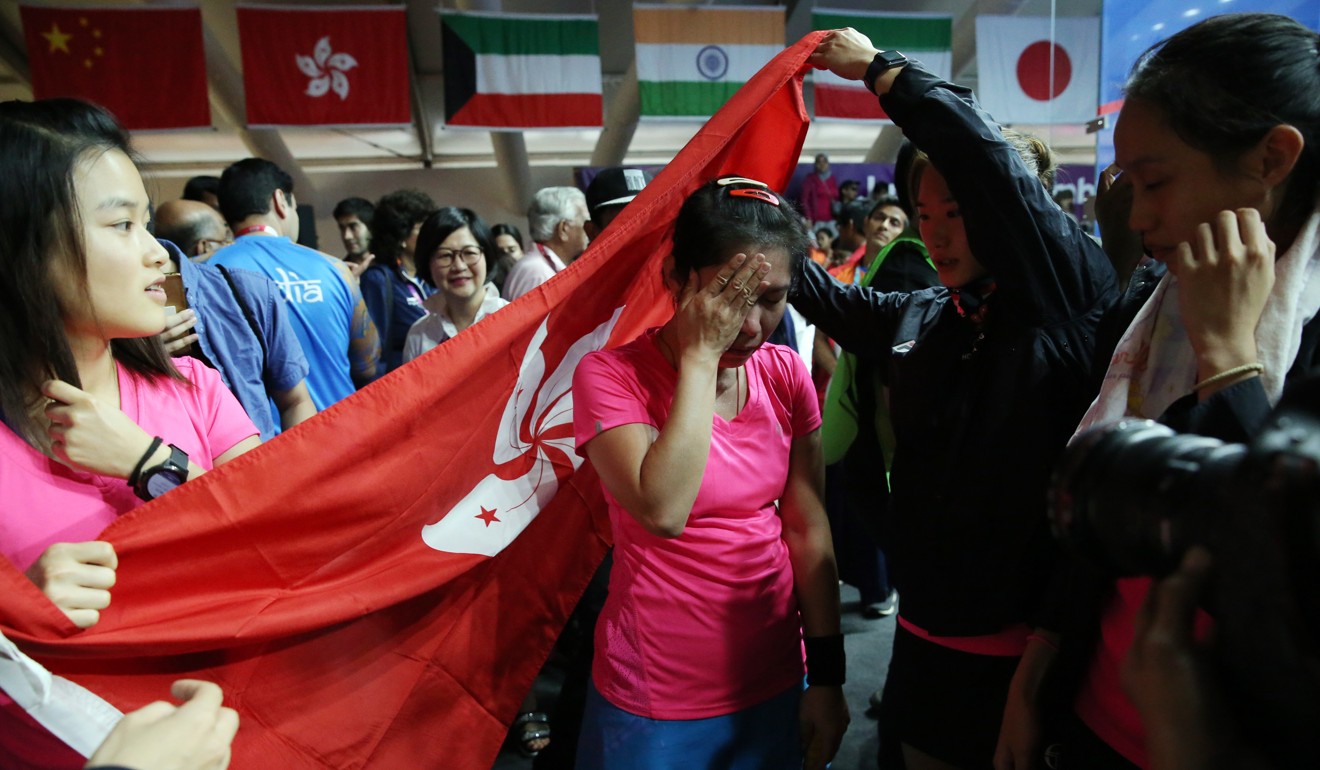 Annie Au is overcome by emotion after helping Hong Kong win team gold at the 2018 Asian Games in Jakarta. Photo: EPA