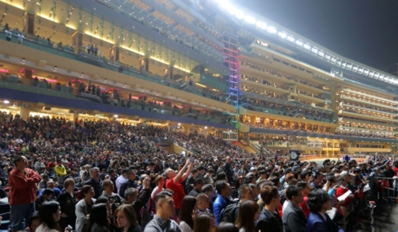 Fans joining the lights up the Happy Valley opening ceremony of Longines Hong Kong International Races 2016. Photo: SCMP