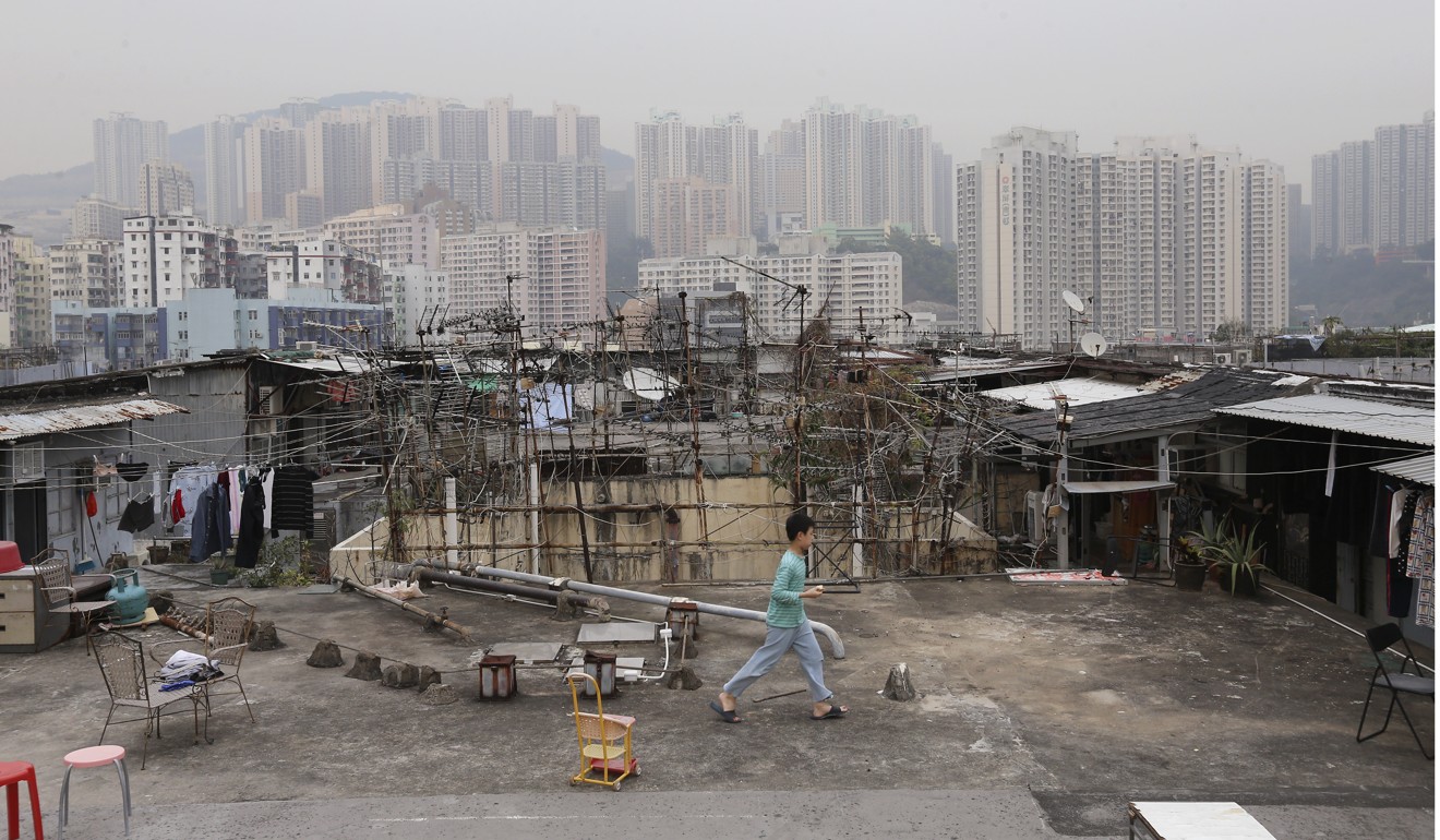 A child living in an illegal home on an industrial building’s rooftop in Kwun Tong, one of Hong Kong’s poorest districts. Photo: Dickson Lee