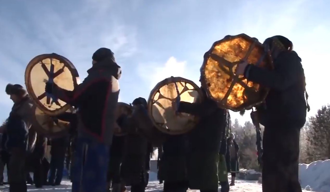 Drums are played as part of a camel-burning shaman ritual in the eastern Siberian city of Angarsk. Photo: YouTube / Eternally Blue Sky