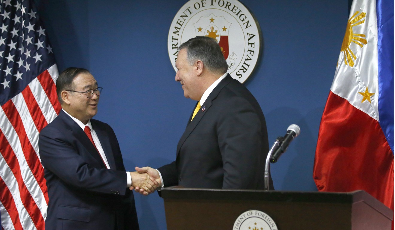 US Secretary of State Mike Pompeo shakes hands with his Philippine counterpart Teddy Locsin in Manila. Photo: AP