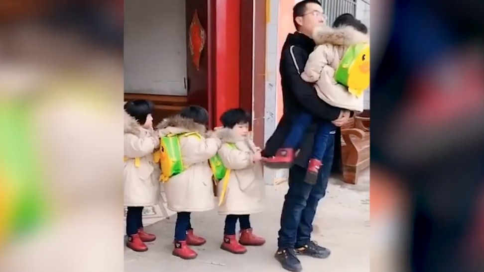 Zhao Jianhua and his wife have lifted themselves out of poverty through the success of their daily live-stream videos of the adventures of their quadruplet daughters. Photo: Thepaper.cn