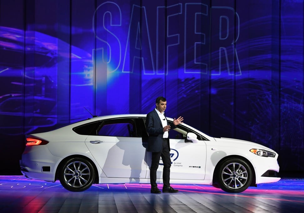 Amnon Shashua, co-founder and chief executive of Mobileye, speaks in front of a Ford Fusion that features the Intel subsidiaryâs autonomous driving technology during a presentation at CES, the world's largest annual consumer technology trade show, in Las Vegas on January 8, 2018. Photo: Agence France-Presse