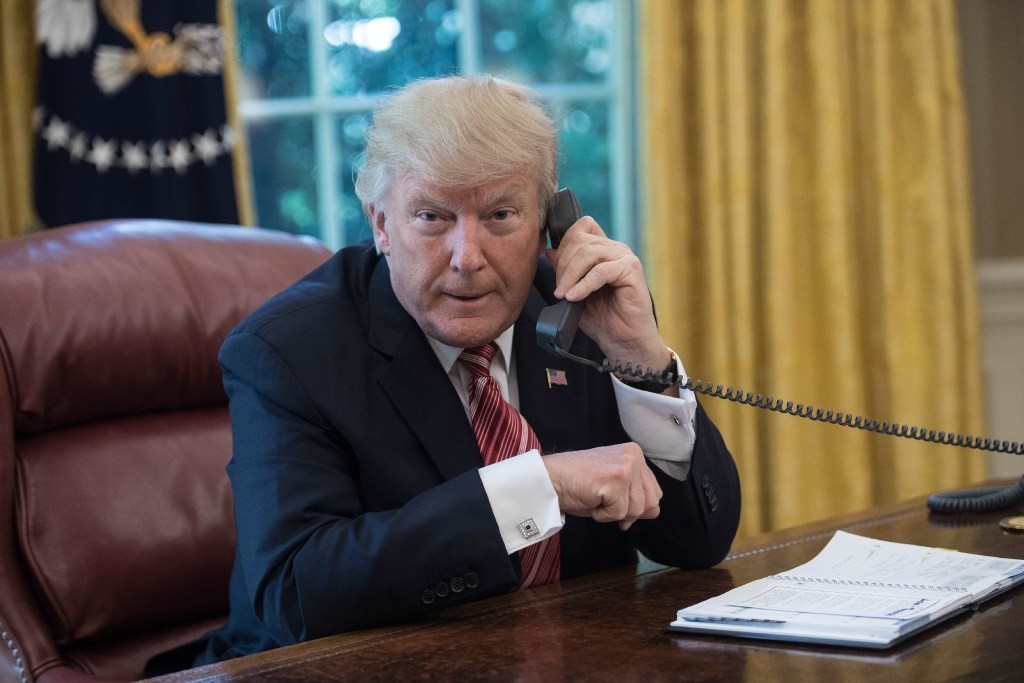 President Trump using the White House landline in June, 2017. (Picture: AFP Photo)