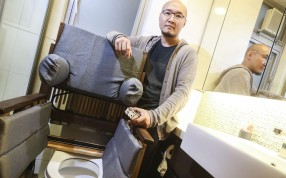 Chun Kwok-tung with the wheelchair he designed at his home in Tsing Yi.Photo: K.Y. Cheng
