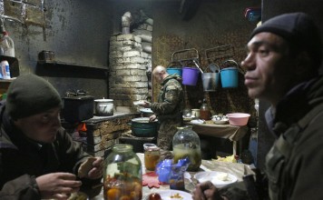 Ukrainian soldiers rest in a shelter near their position on the Butovka Coal Mine in Donetsk area, Ukraine, on Thursday. Photo: EPA