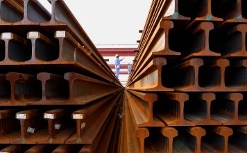 Welders make preparations for putting together steel rails at Xiaolizhuang Welding Base of Mechanical Works Section in Zhengzhou, capital of central China's Henan Province. Steel profits are surging, but the industry is fretting about the state of the Chinese industry. Photo: Xinhua