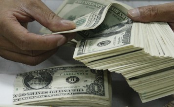 Europe and America overflowing with new buildings and cars. Wealth is finally trickling down to the middle-class guy who (when he is not working all the hours he can get to pay his medical bills) is filling restaurants, ordering taxis and buying new phones. Happy days are here again, says Richard Harris. Photo: Reuters