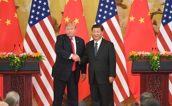 US President Donald Trump and Chinese President Xi Jinping shake hands at a joint news conference held after their meeting in Beijing. Photo: Kyodo