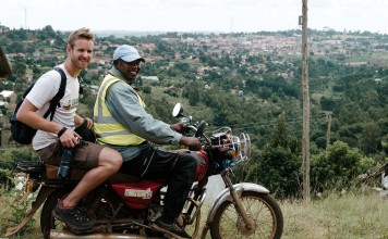 Uganda – Spent the day on the back of a motorcycle (boda) to photograph the Uganda Marathon. Sometimes using my rucksack to strap myself to the driver so I could face backwards and photograph as we moved. Photo: Richard Tilney-Bassett