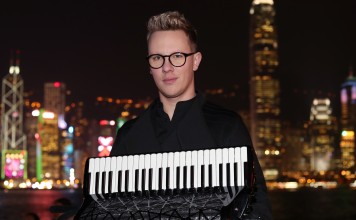 Martynas Levickis, an accordion player, poses for a portrait in Tsim Sha Tsui. Picture: K. Y. Cheng