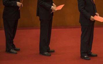 National People’s Congress delegates line up to cast their ballots at the Great Hall of the People in Beijing on Sunday. Photo: Bloomberg