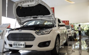 A Ford vehicle stands on display at a showroom in Shanghai. The US-China trade war is taking a toll on companies from both sides. Photo: Bloomberg