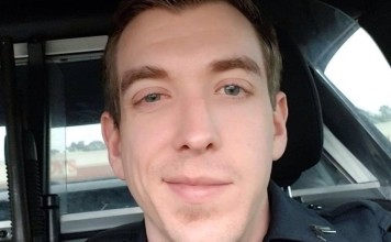 Candlelight service organised outside the Brookhaven Police Department where the officers had worked is marked by flowers, teddy bears and balloons