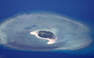 An uninhabited island in the disputed Spratly chain. An American warship passed through waters near the islands on Sunday. Photo: Reuters
