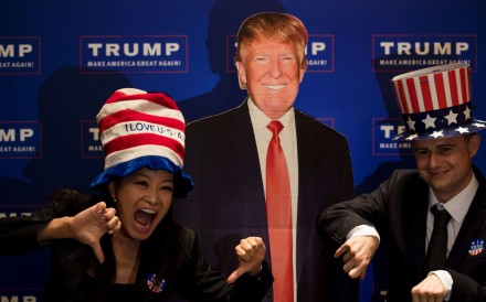 A couple poses next to a cardboard cutout of US presidential candidate Donald Trump during an election event organised by the US consulate in Shanghai on Wednesday. Photo: AFP A couple poses next to a cardboard cutout of US presidential candidate Donald Trump during an election event organised by the US consulate in Shanghai on Wednesday. Photo: AFP