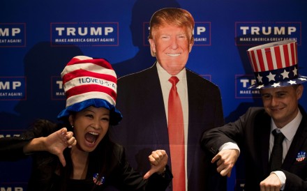 A couple poses next to a cardboard cutout of US presidential candidate Donald Trump during an election event organised by the US consulate in Shanghai on Wednesday. Photo: AFP
