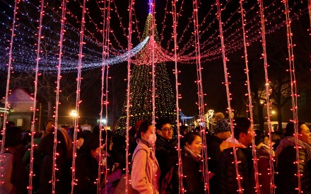 Catholics queue up to enter the state-approved Xuanwumen Catholic Church, otherwise known as the South Cathedral in Beijing, on Christmas Eve. Photo: EPA