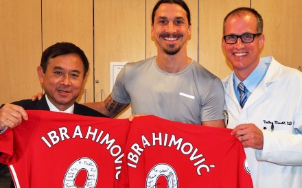 Dr Freddie Fu and fellow surgeon Volker Musahl with Zlatan Ibrahimovic. Photo: Freddie Fu