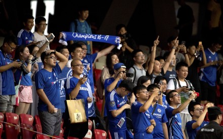 Chinese fans of Chelsea cheer during the team's practice session at the National Stadium. Photo: AP