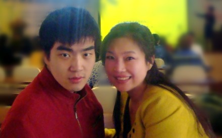 Ding Ding, left, credits his mother with pushing him to achieve his goals despite his cerebral palsy. Photo: Handout Ding Ding, left, credits his mother with pushing him to achieve his goals despite his cerebral palsy. Photo: Handout