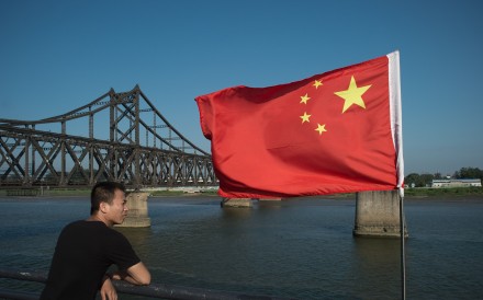 A Chinese man looks across the Yalu river towards North Korea. Photo: AFP A Chinese man looks across the Yalu river towards North Korea. Photo: AFP