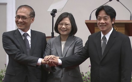 Taiwan’s President Tsai Ing-wen (centre) holds hands with outgoing premier Lin Chuan (left) and his successor William Lai Chin-te on Tuesday in Taipei. Photo: AP