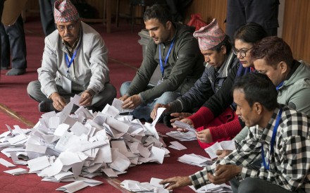 Nepalese officials of the Election Commission begin the counting of the votes. Photo: EPA