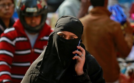 A Muslim walks through a market in New Delhi, India. There has been a spate of recent hate crimes against Muslims in India. Photo: Reuters