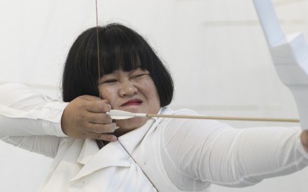 Melati Suryodarmo performs her performance art Transaction of Hollows (2018). Photo: Courtesy of ShanghART Gallery