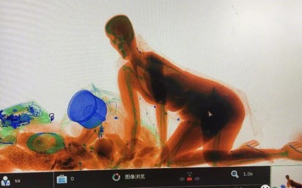 Ghostly images of the woman being X-rayed by a security scanner at a railway station in southern China became a huge hit online. Photo: Weibo.