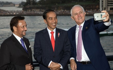 Australia’s Prime Minister Malcolm Turnbull (right) takes a selfie with Brunei’s Sultan Hassanal Bolkiah (left) and Indonesia’s President Joko Widodo at the leaders dinner on the sidelines of the Asean-Australia Special Summit. Photo: AFP