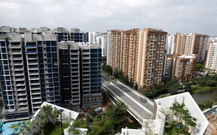 A private condominium is constructed next to a public housing estate in Singapore in February 2017. Eighty per cent of Singaporeans live in government-built housing. Photo: Reuters