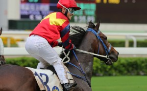Keith Yeung returns on Travel Brother after the five-year-old returned to something near his best to win the Class One mile. Photo: Kenneth Chan