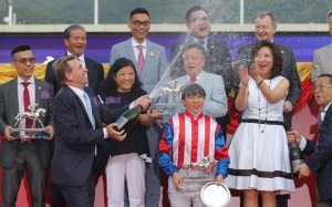 John Size celebrates after clinching the trainers’ championship. Photo: Kenneth Chan