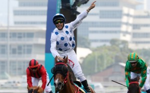 Brett Prebble salutes as Contentment wins the Group One Champions Mile. Photos: Kenneth Chan