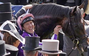 Padraig Beggy dismounts after winning the Derby Stakes with Wings Of Eagles. Photo: Racing UK