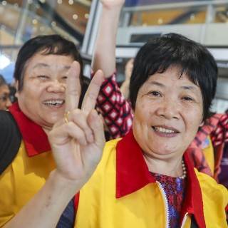 Excited passengers on cross-border coaches take selfies at the immigration clearance building Hong Kong's transport secretary says he is not expecting large volume of traffic on first day of service